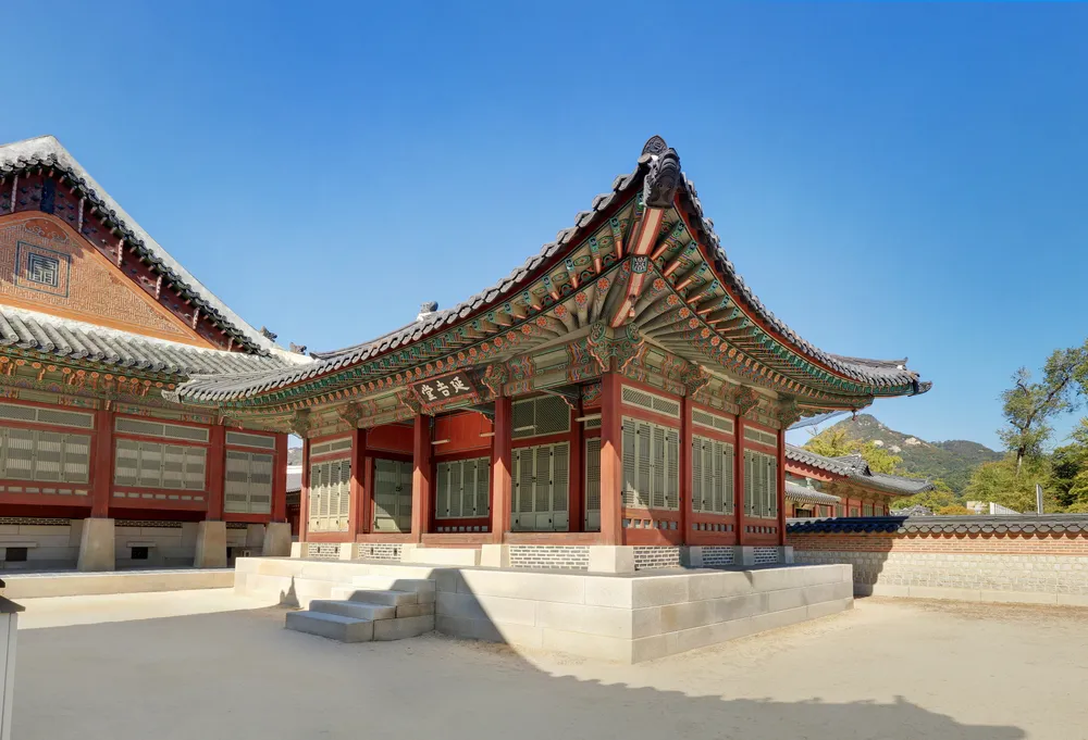 Sujeongjeon hall at Gyeongbokgung Palace, a wide single-storey building with painted eaves