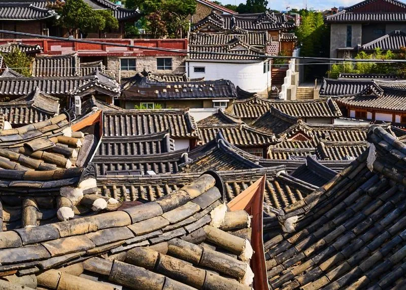 Curved tiled rooftops of hanok houses in Bukchon Hanok Village, Seoul