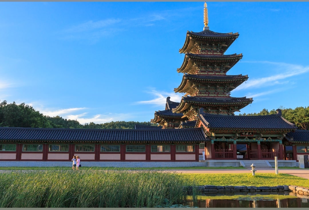 Baekje Cultural Land's five-story Baekje pagoda under a clear autumn sky