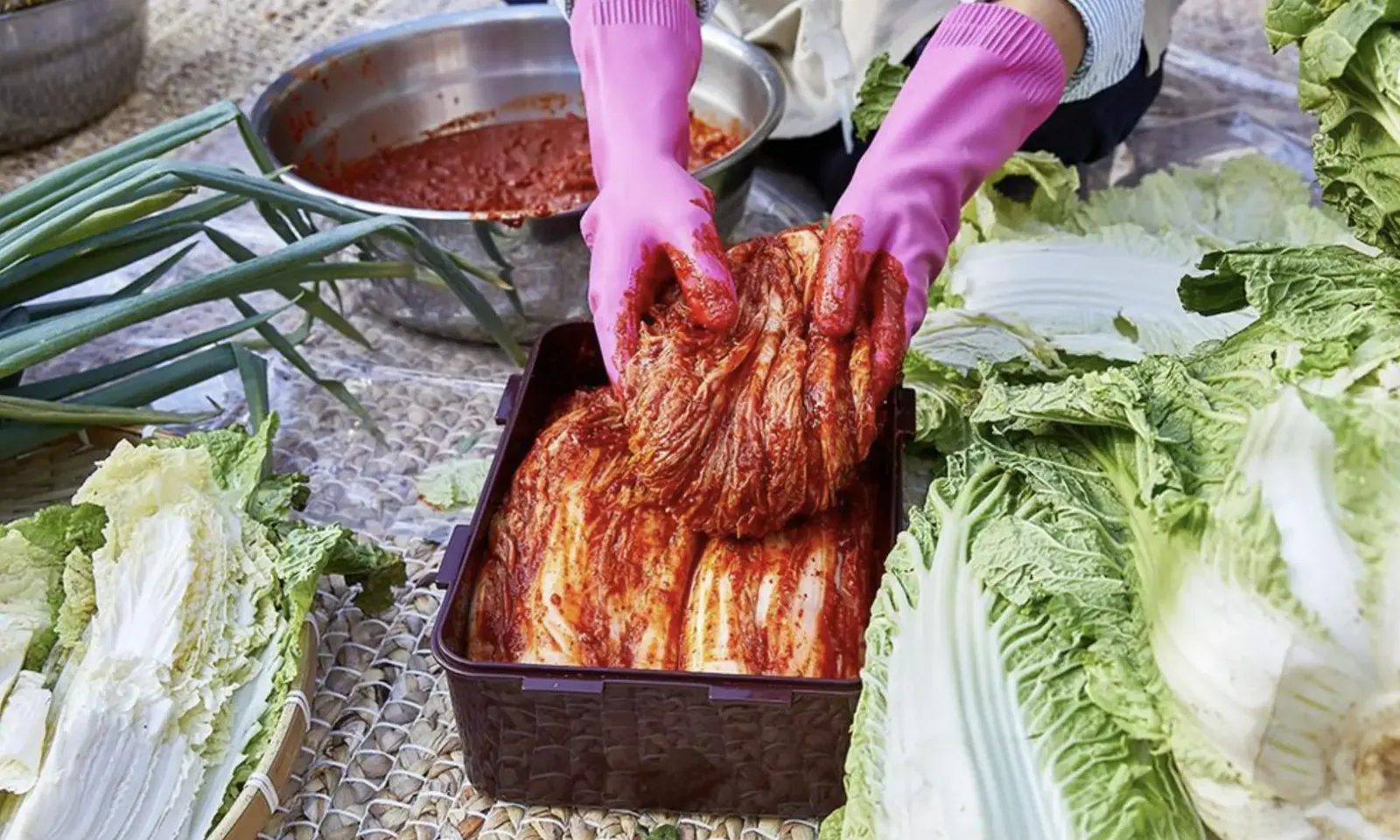 Fresh Korean ingredients and sauces laid out for a market cooking class