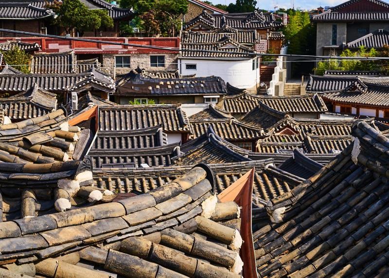 Curved tiled rooftops of hanok houses in Bukchon Hanok Village, Seoul
