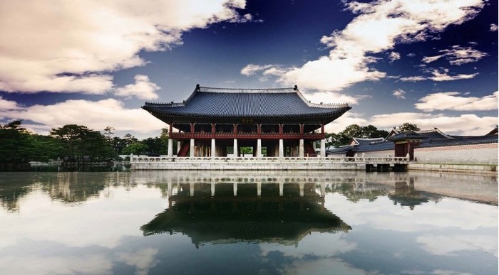 Gyeonghoeru Pavilion at Gyeongbokgung Palace reflected in the royal lake under an autumn sky