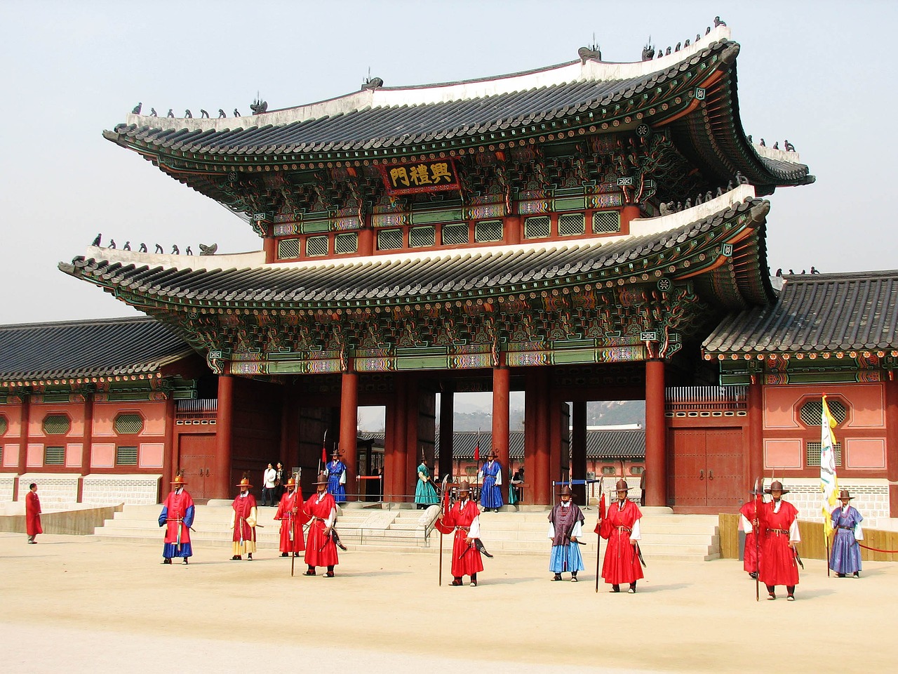 Heungnyemun gate at Gyeongbokgung Palace with royal guards in traditional uniforms