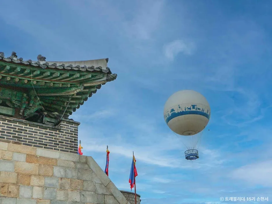 The Flying Suwon tethered balloon floating above Hwaseong Fortress