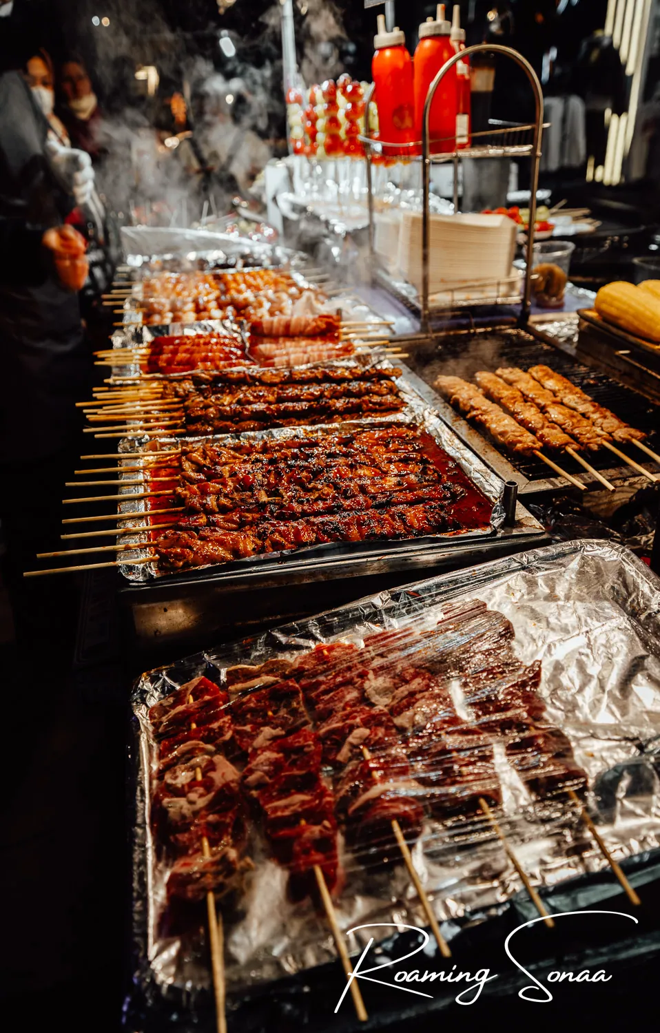 Glowing Myeongdong street food stalls with tteokbokki skewers in Seoul